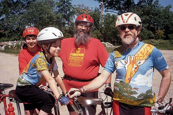 Two tandem teams with leather saddles