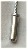 Bicycle cable end, by Armchair, CC BY-SA 3.0 via Wikimedia Commons, cropped