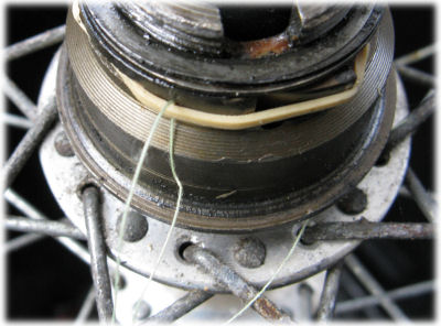 rubber band and thread to hold pawls down