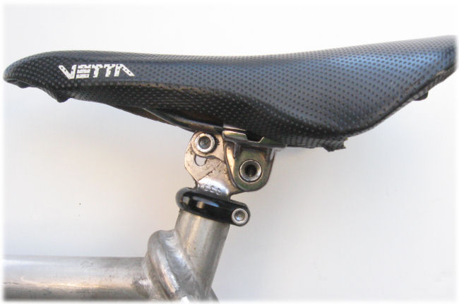 Pivot and clamp seatpost