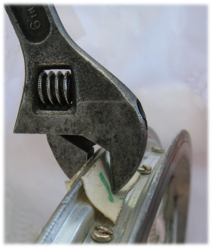 removing a rim blip with an adjustable wrench