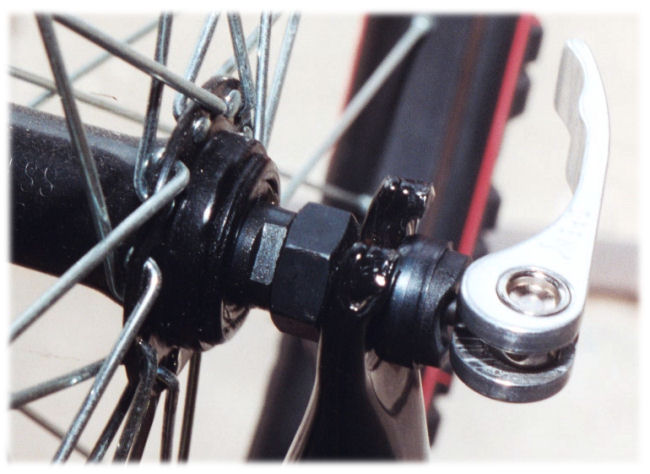 external-cam quick-release hazard